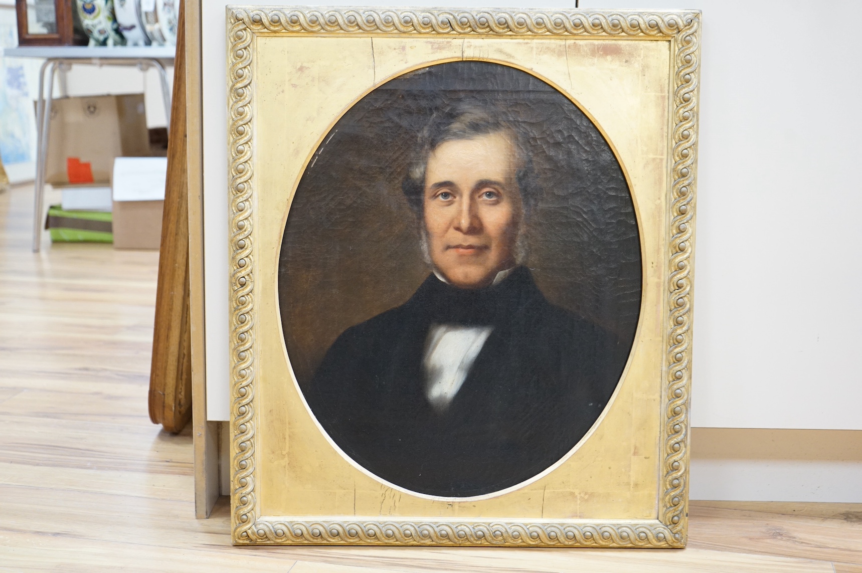 Mid 19th century, English School, feigned oval oil on canvas, Portrait of a gentleman, unsigned, 58 x 48cm, gilt framed. Condition - fair to good